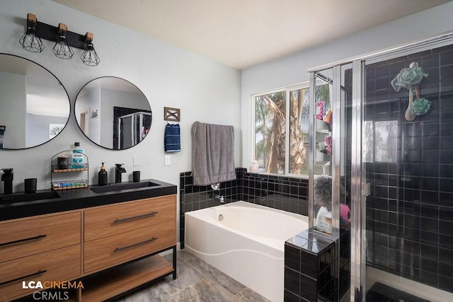 11703 Revolution Rd, Bakersfield, CA 93312 - full bath featuring vanity, a shower stall, and a bath