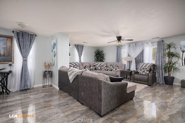 11703 Revolution Rd, Bakersfield, CA 93312 - living area with marble tiled flooring, ceiling fan, and baseboards