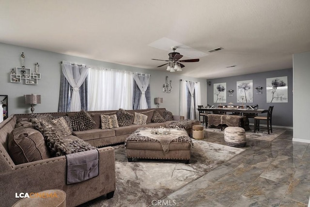 11703 Revolution Rd, Bakersfield, CA 93312 - living room featuring a ceiling fan, baseboards, and marble finish flooring