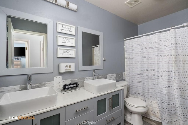 11703 Revolution Rd, Bakersfield, CA 93312 - bathroom featuring toilet, double vanity, and a shower with shower curtain