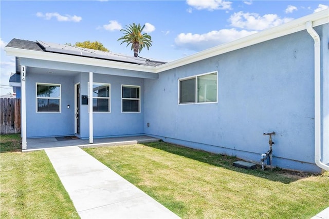 114 N Orange Ave, Fullerton, CA 92833 - view of front of house featuring solar panels and stucco siding
