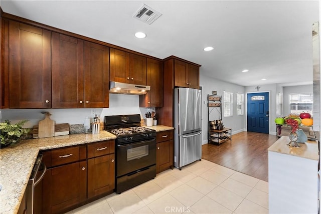 114 N Orange Ave, Fullerton, CA 92833 - kitchen with appliances with stainless steel finishes, under cabinet range hood, recessed lighting, light stone countertops, and baseboards