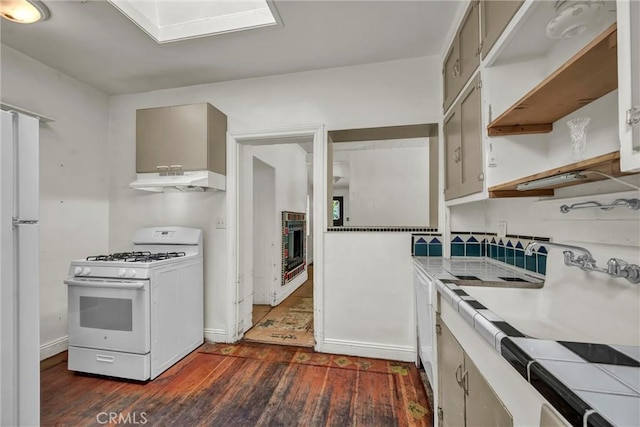 21345 Bush St, Middletown, CA 95461 - kitchen featuring white appliances, dark wood-type flooring, under cabinet range hood, and open shelves