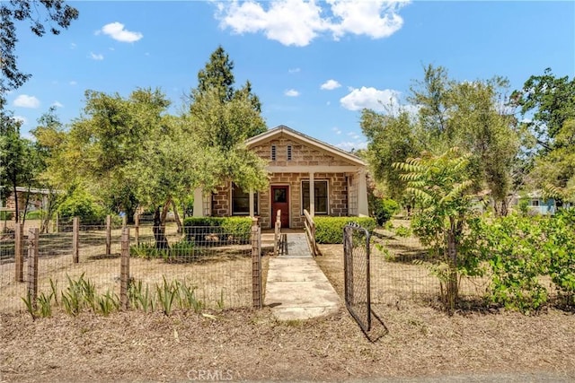 21345 Bush St, Middletown, CA 95461 - view of front of home with a porch, a fenced front yard, and a gate