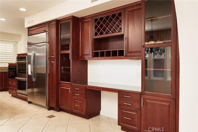 6471 Frampton Cir, Huntington Beach, CA 92648 - kitchen with appliances with stainless steel finishes, dark brown cabinets, light tile patterned floors, open shelves, and recessed lighting