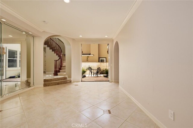 6471 Frampton Cir, Huntington Beach, CA 92648 - hall with arched walkways, crown molding, light tile patterned flooring, recessed lighting, and stairway