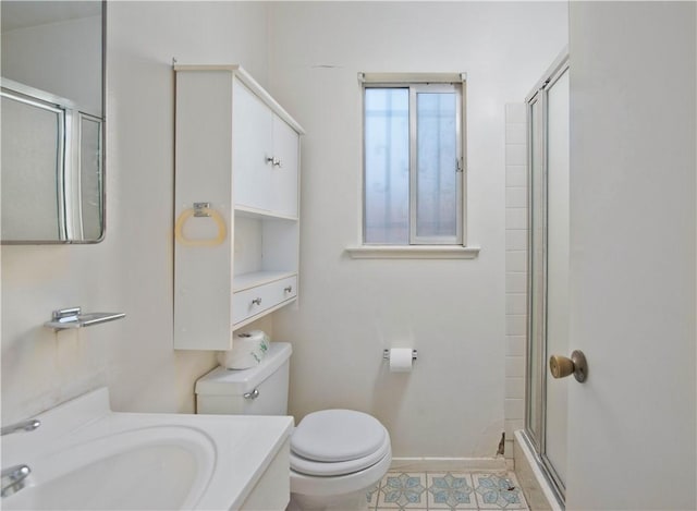 16751 Ludlow St, Granada Hills, CA 91344 - bathroom featuring toilet, a shower with shower door, vanity, and tile patterned flooring