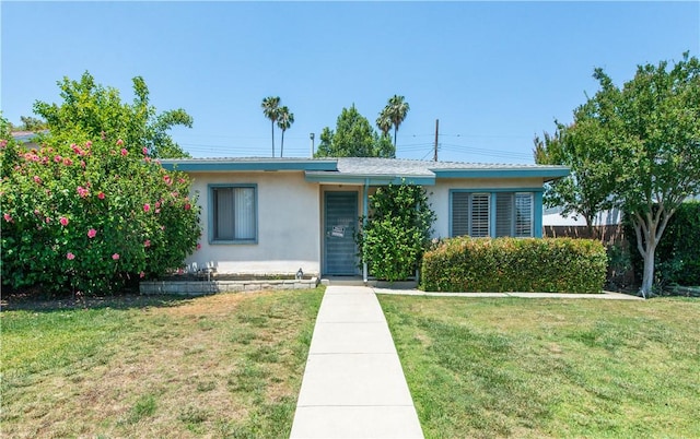 16751 Ludlow St, Granada Hills, CA 91344 - view of front of house featuring stucco siding and a front yard