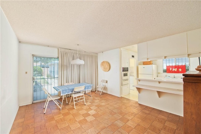 16751 Ludlow St, Granada Hills, CA 91344 - dining area featuring a textured ceiling