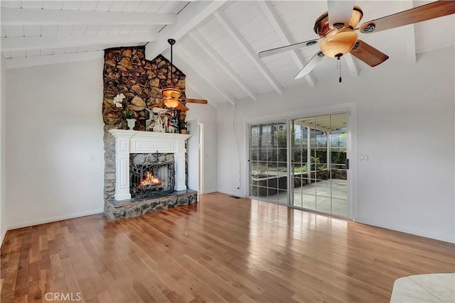 786 S Spanish Oak Ln, La Puente, CA 91746 - unfurnished living room with a ceiling fan, wood finished floors, a stone fireplace, and baseboards