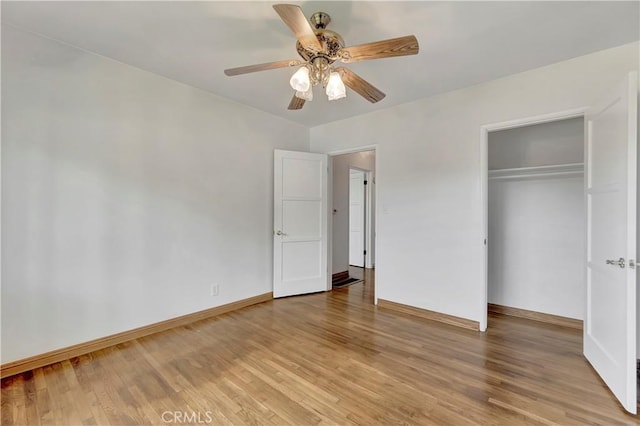 786 S Spanish Oak Ln, La Puente, CA 91746 - unfurnished bedroom featuring light wood-style floors, baseboards, a closet, and a ceiling fan
