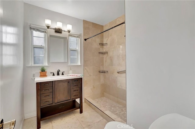 786 S Spanish Oak Ln, La Puente, CA 91746 - bathroom with toilet, a tile shower, vanity, tile patterned floors, and baseboards