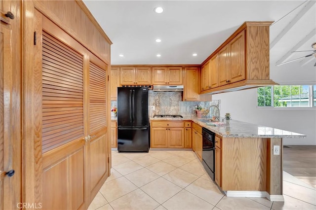 786 S Spanish Oak Ln, La Puente, CA 91746 - kitchen featuring black appliances, a sink, light stone countertops, backsplash, and light tile patterned flooring