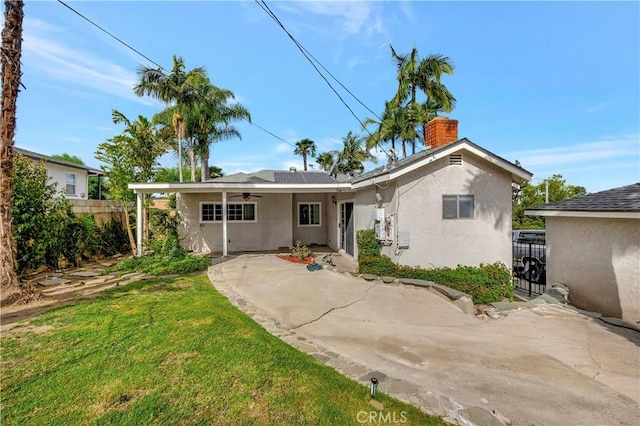 786 S Spanish Oak Ln, La Puente, CA 91746 - view of front of house featuring ceiling fan, stucco siding, a chimney, and a patio area