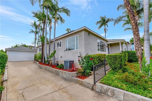 786 S Spanish Oak Ln, La Puente, CA 91746 - view of front of property with stucco siding, an outdoor structure, central AC, and a garage