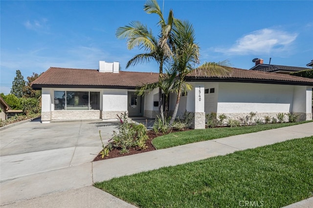 1540 Coachwood St, La Habra, CA 90631 - ranch-style home with stucco siding, a tiled roof, and a front yard