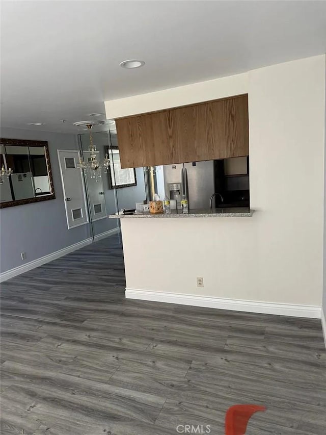 3880 W Jacinto View Rd Unit M, Banning, CA 92220 - kitchen with baseboards, dark wood-type flooring, recessed lighting, a peninsula, and stainless steel fridge with ice dispenser
