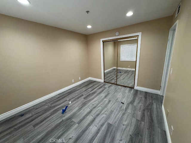 3880 W Jacinto View Rd Unit M, Banning, CA 92220 - unfurnished bedroom with baseboards, wood finished floors, recessed lighting, and a closet