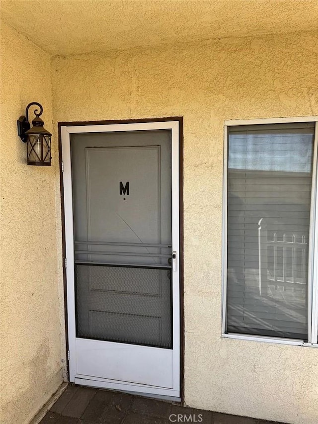 3880 W Jacinto View Rd Unit M, Banning, CA 92220 - doorway to property featuring stucco siding