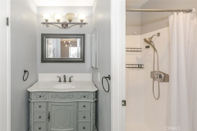 28031 Sarabande Ln Unit 128, Canyon Country, CA 91387 - bathroom featuring a shower stall, vanity, and a chandelier