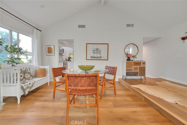 4326 Via Verde, Cypress, CA 90630 - dining space featuring light wood-type flooring, high vaulted ceiling, and beamed ceiling