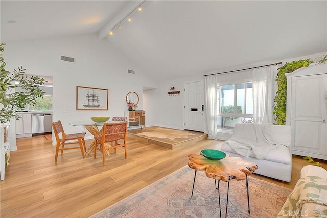 4326 Via Verde, Cypress, CA 90630 - living room with light wood-type flooring, rail lighting, high vaulted ceiling, and beam ceiling