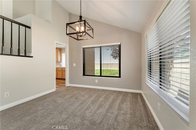 5809 Almond Valley Way, Lancaster, CA 93536 - carpeted empty room with a chandelier, baseboards, and high vaulted ceiling