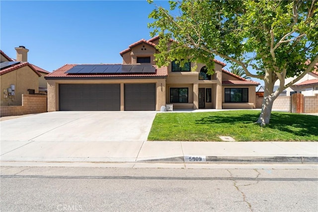 5809 Almond Valley Way, Lancaster, CA 93536 - mediterranean / spanish-style house with an attached garage, stucco siding, solar panels, and a tile roof