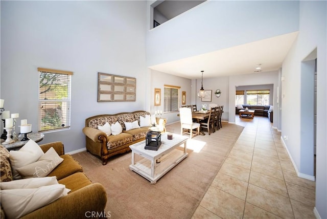 31786 Sorrel Run Ct, Menifee, CA 92584 - living area with light tile patterned flooring, baseboards, and a towering ceiling