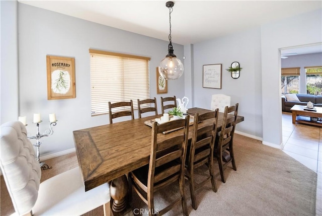 31786 Sorrel Run Ct, Menifee, CA 92584 - dining area featuring light colored carpet, baseboards, and light tile patterned flooring