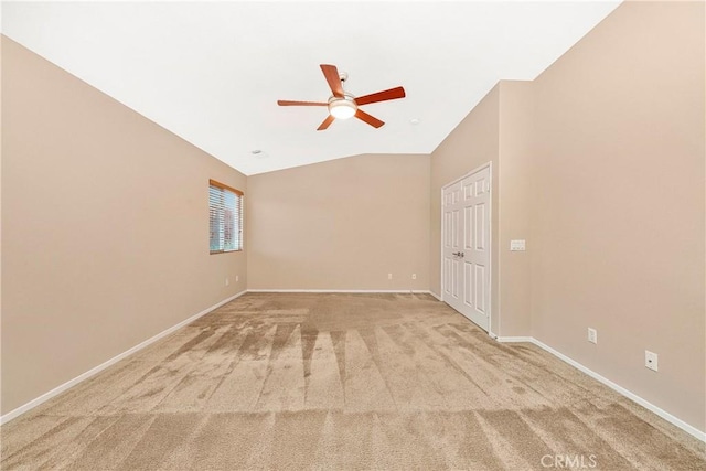 44224 Raven Ln, Lancaster, CA 93536 - empty room featuring ceiling fan, light colored carpet, baseboards, and vaulted ceiling