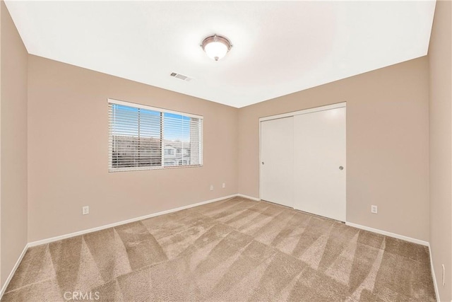 44224 Raven Ln, Lancaster, CA 93536 - unfurnished bedroom featuring carpet floors, baseboards, and a closet