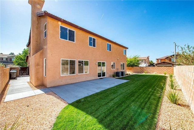 44224 Raven Ln, Lancaster, CA 93536 - rear view of property with central AC unit, stucco siding, and a patio area