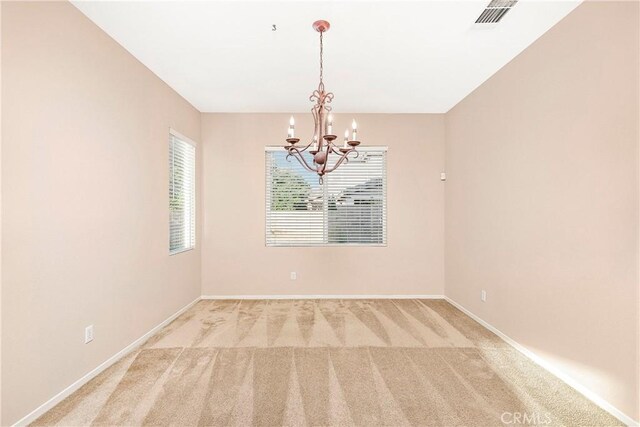 44224 Raven Ln, Lancaster, CA 93536 - spare room with a chandelier, light carpet, and baseboards