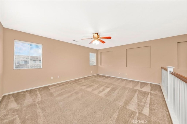 44224 Raven Ln, Lancaster, CA 93536 - spare room with a ceiling fan, plenty of natural light, light carpet, and baseboards
