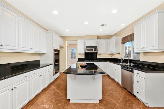 44224 Raven Ln, Lancaster, CA 93536 - kitchen with appliances with stainless steel finishes, a sink, white cabinets, and recessed lighting