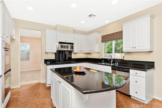 44224 Raven Ln, Lancaster, CA 93536 - kitchen with a sink, appliances with stainless steel finishes, white cabinetry, and recessed lighting