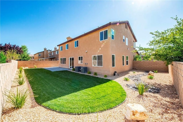 44224 Raven Ln, Lancaster, CA 93536 - back of house with cooling unit, stucco siding, and a patio area