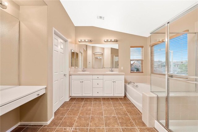 44224 Raven Ln, Lancaster, CA 93536 - full bathroom featuring double vanity, vaulted ceiling, a garden tub, and a shower with door