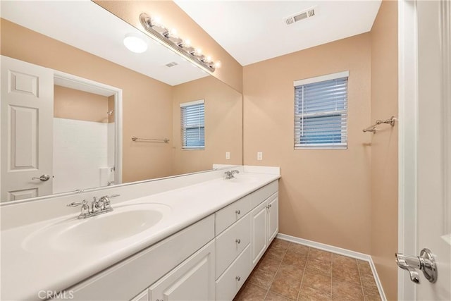 44224 Raven Ln, Lancaster, CA 93536 - full bath featuring double vanity and baseboards