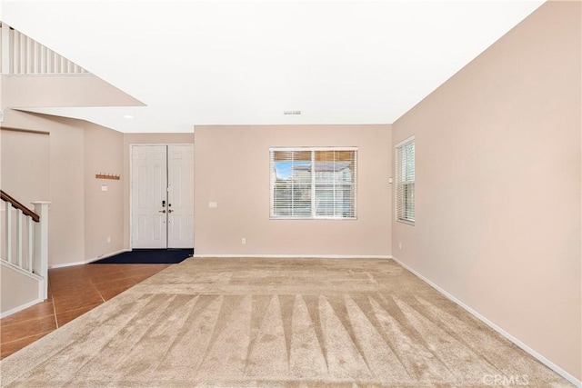 44224 Raven Ln, Lancaster, CA 93536 - tiled entrance foyer with stairway, baseboards, and carpet floors