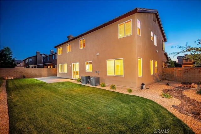 44224 Raven Ln, Lancaster, CA 93536 - rear view of property with a patio, stucco siding, central air condition unit, and a chimney