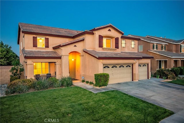 44224 Raven Ln, Lancaster, CA 93536 - view of front of house featuring driveway, a tiled roof, an attached garage, a front yard, and stucco siding