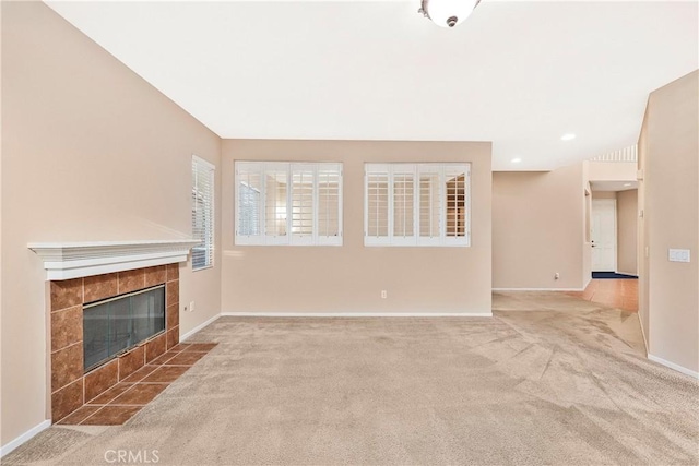 44224 Raven Ln, Lancaster, CA 93536 - unfurnished living room featuring carpet, a tiled fireplace, and baseboards