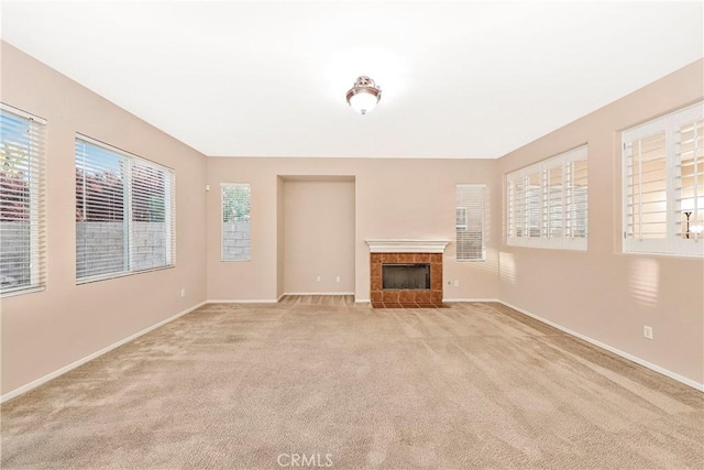 44224 Raven Ln, Lancaster, CA 93536 - unfurnished living room featuring light colored carpet, baseboards, and a tile fireplace