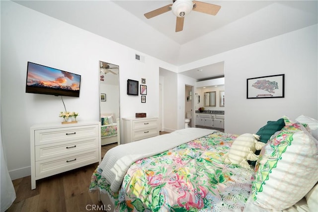 36 Via Lavendera, Rancho Santa Margarita, CA 92688 - bedroom with dark wood-style floors, ensuite bath, ceiling fan, and baseboards