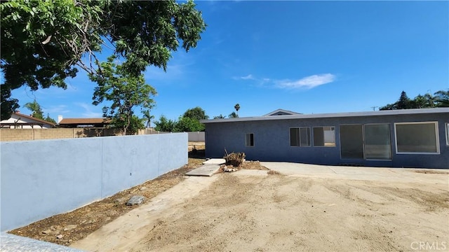 2045 S Cypress Ave, Ontario, CA 91762 - rear view of property with stucco siding and a patio area