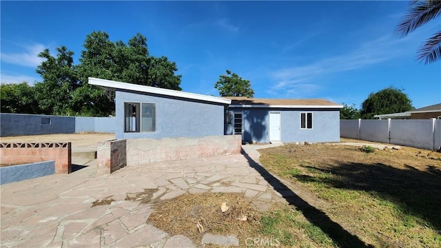 2045 S Cypress Ave, Ontario, CA 91762 - view of front facade featuring stucco siding, a patio area, and a fenced backyard