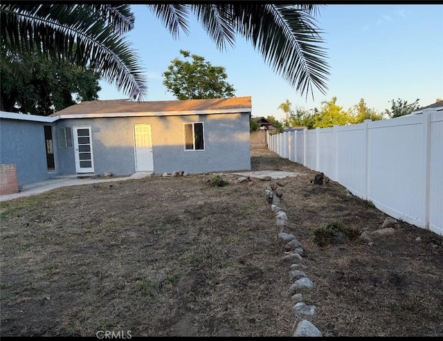 2045 S Cypress Ave, Ontario, CA 91762 - back of house featuring stucco siding and a fenced backyard
