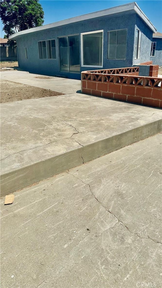 2045 S Cypress Ave, Ontario, CA 91762 - back of house featuring stucco siding and a patio area